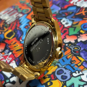 Relógio masc analógico aço inox aro dourado calendario fundo azul Quartz